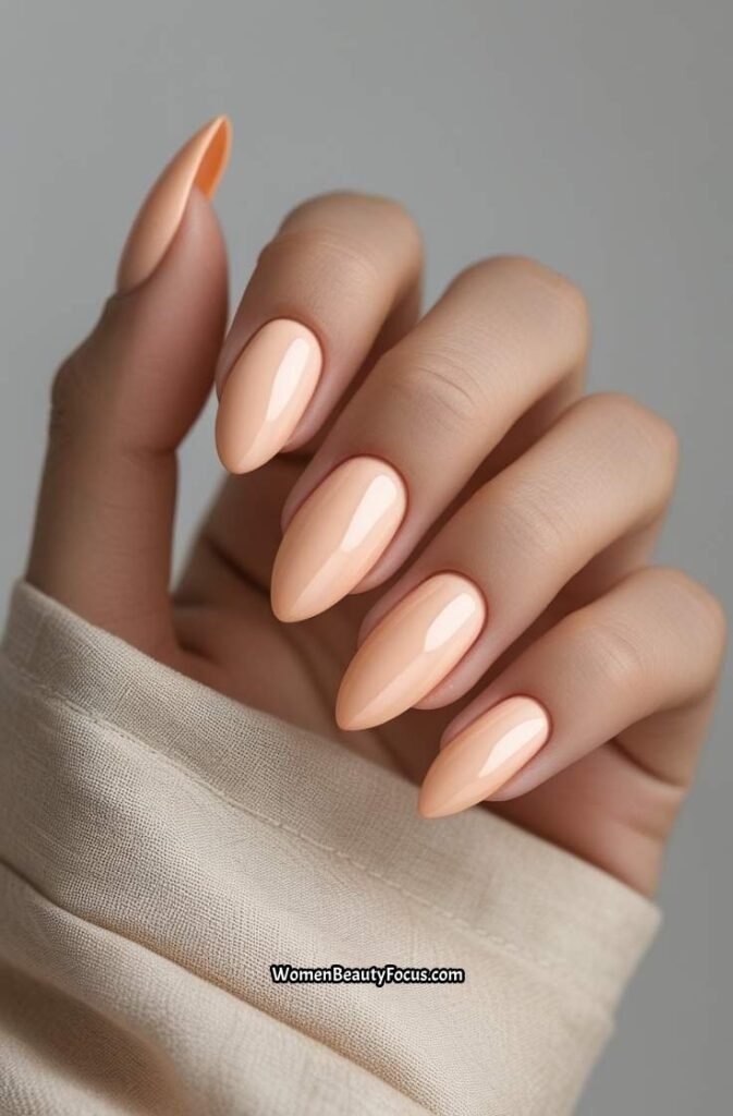 1. Soft Peach Almond Nails with Subtle Gloss