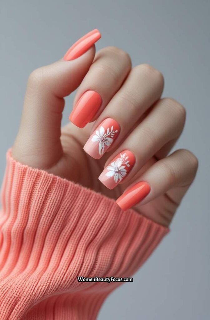 10. Coral Nail Design with White Floral Art