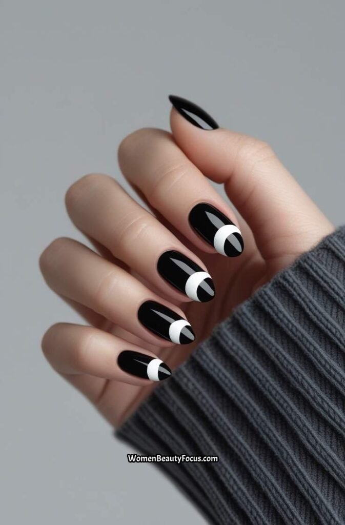 10. Glossy Black Nails with White Half Moons