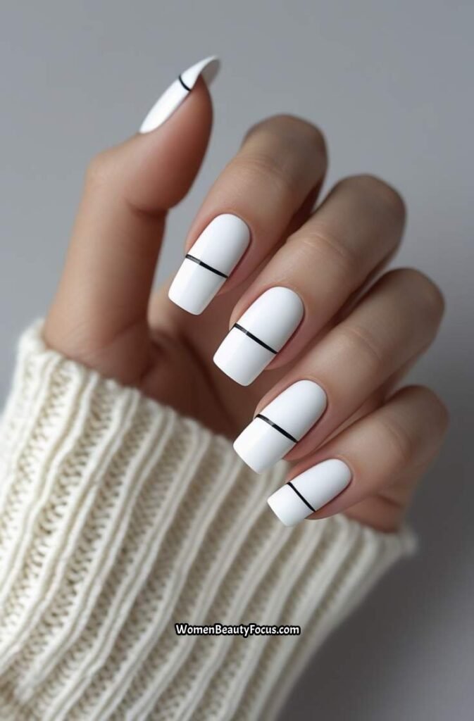 10. Minimalist White Nails with Black Accents