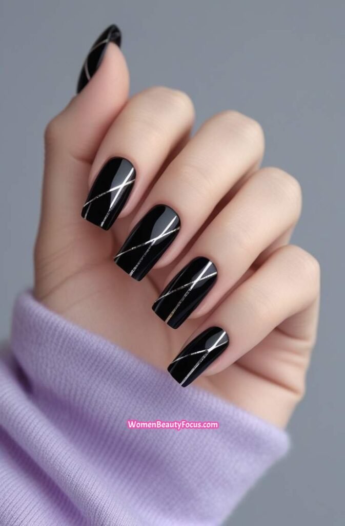 10. Shiny Black Nails with Silver Chrome Lines
