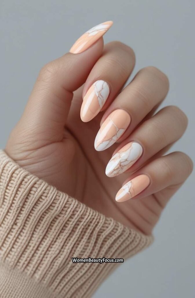 10. Soft Peach Marble Nails