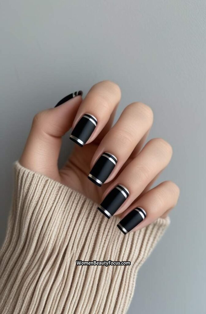 11. Black French Tips with Minimalist Silver Stripes