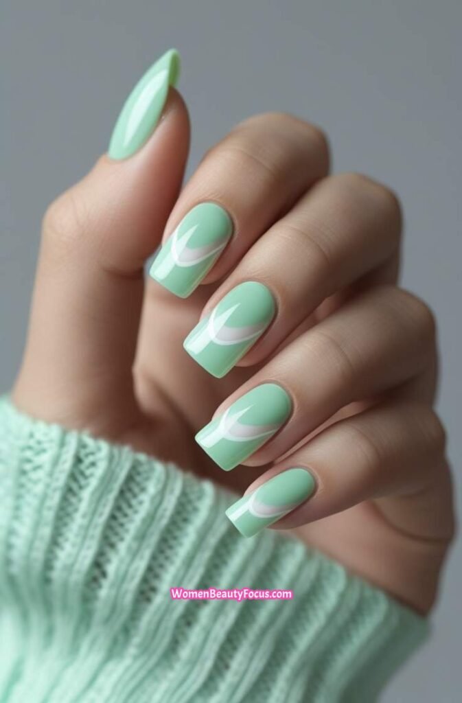 12. Cool Mint Cat Eye Nails