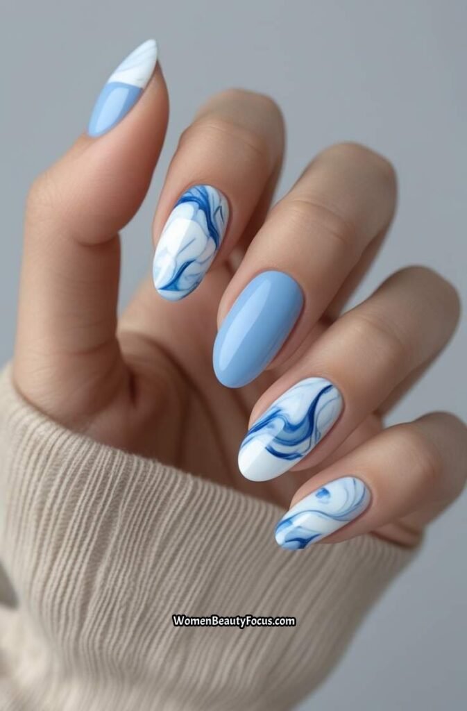 12. Cornflower Blue Nails with Marble Accents