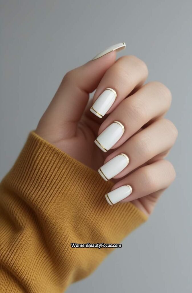 12. French Tips with Minimalist Gold Lines