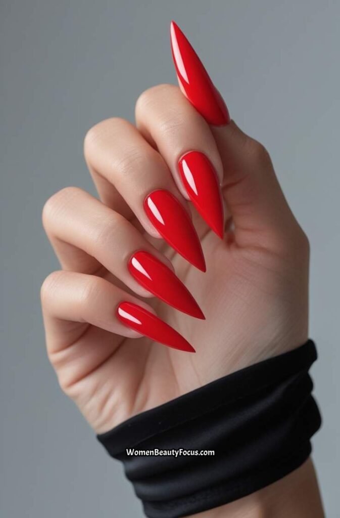 13. Bold Red Stiletto Nails