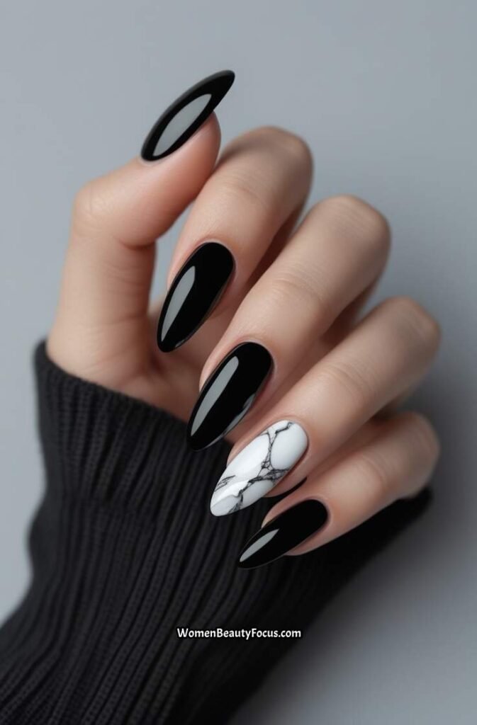 13. Classic Black Nails with White Marble Effect