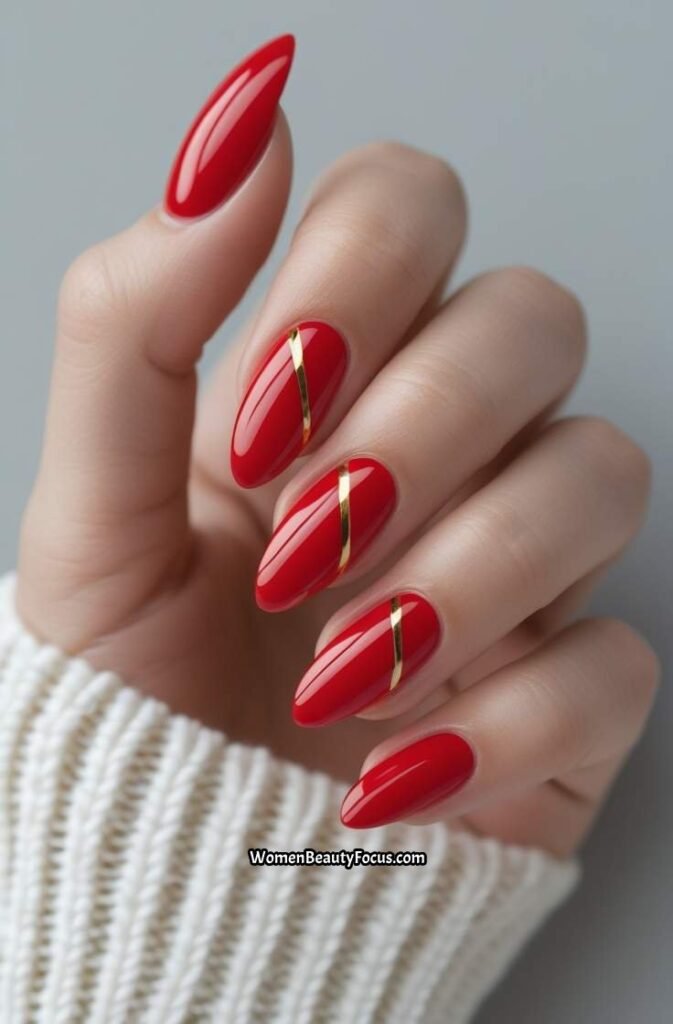 13. Classic Red Almond Nails with Gold Details