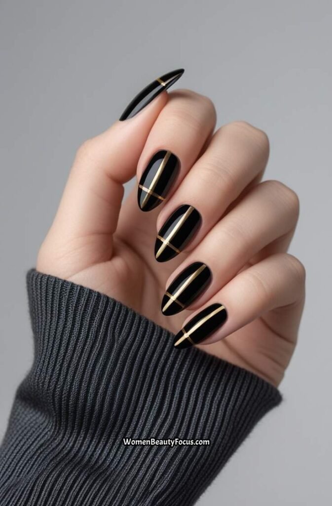 13. Classy Black and Gold Nails