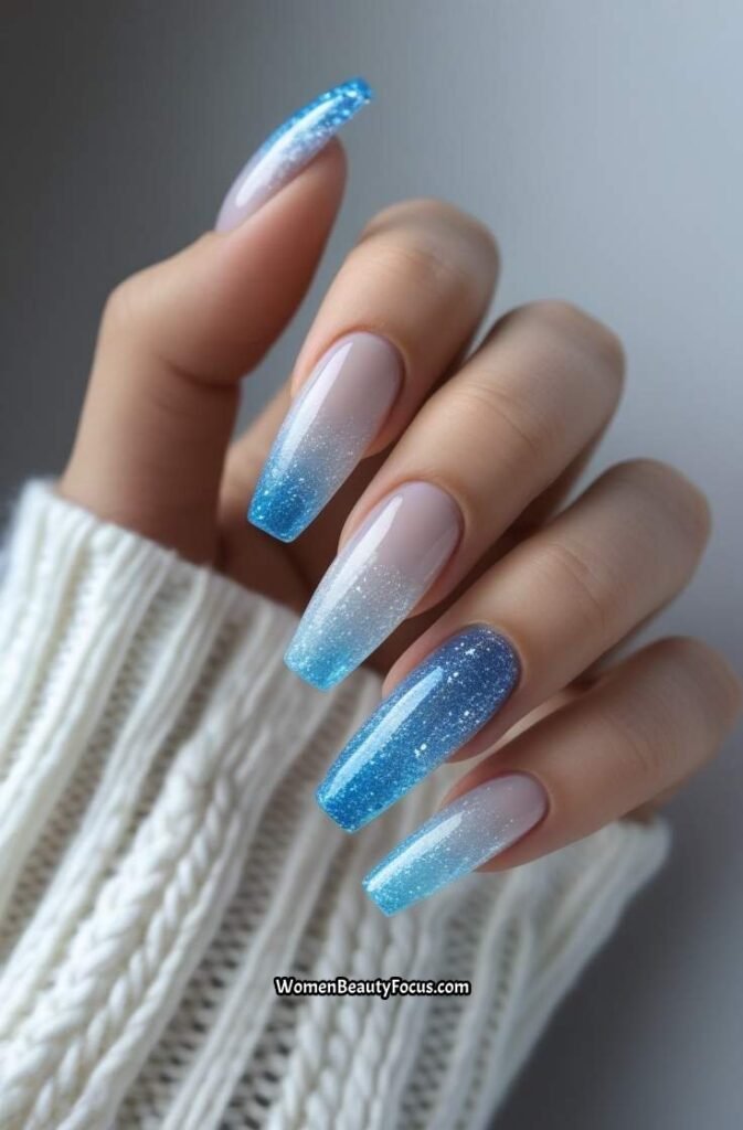 13. Icy Blue Glitter Ombre Nails