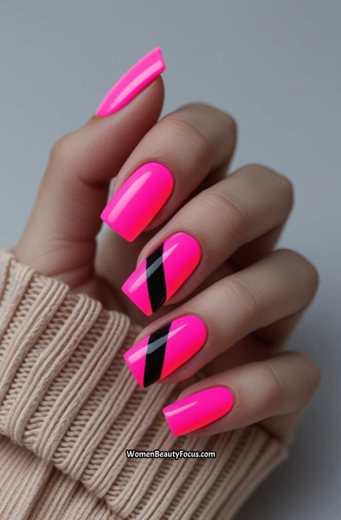 13. Neon Pink Nails with Black Stripes