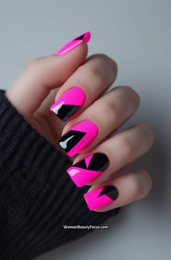 13. Neon Pink and Black Abstract Nails