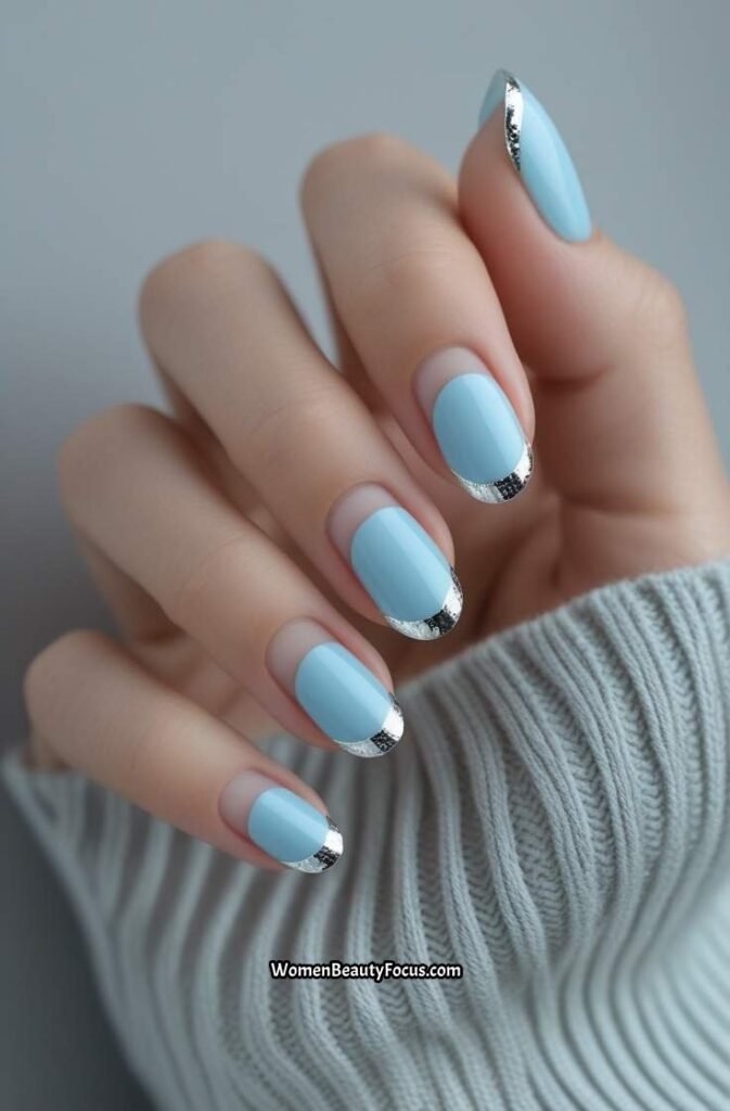 13. Soft Blue French Tips with Silver Detailing