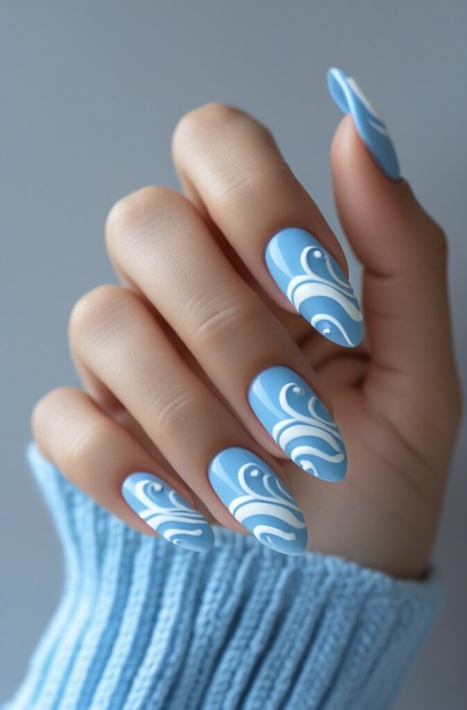 14. Almond Nails with Blue and White Swirls