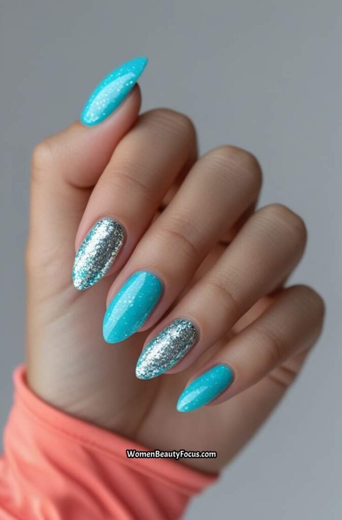 14. Aqua Blue Nails with Silver Glitter