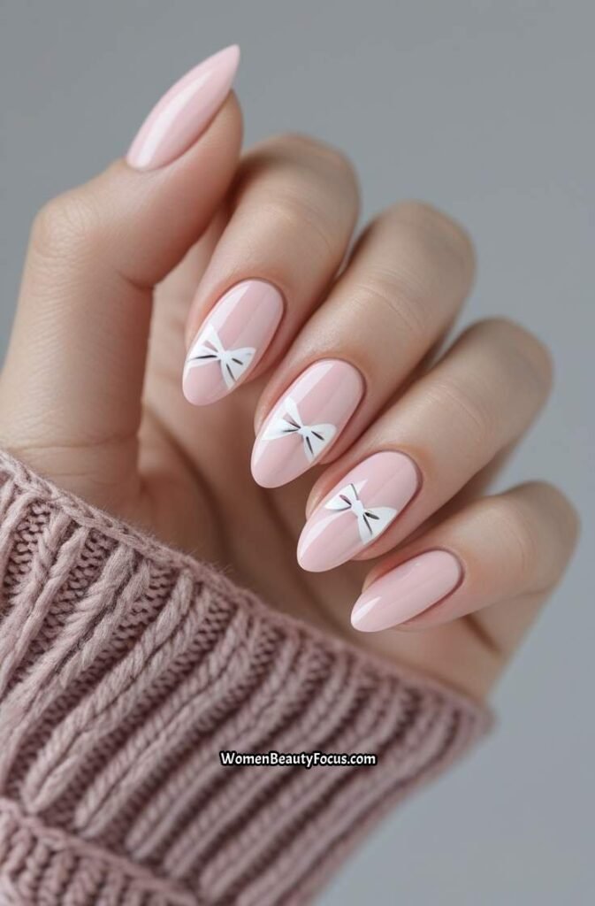 14. Baby Pink Nails with Tiny Bows