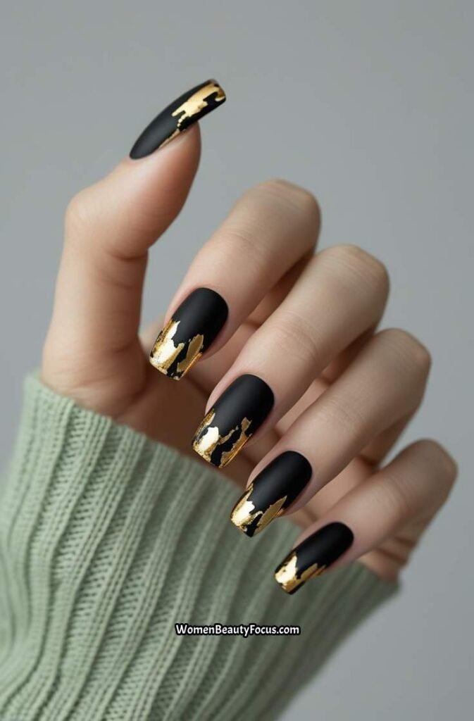 14. Black Nails with Gold Foil French Tips