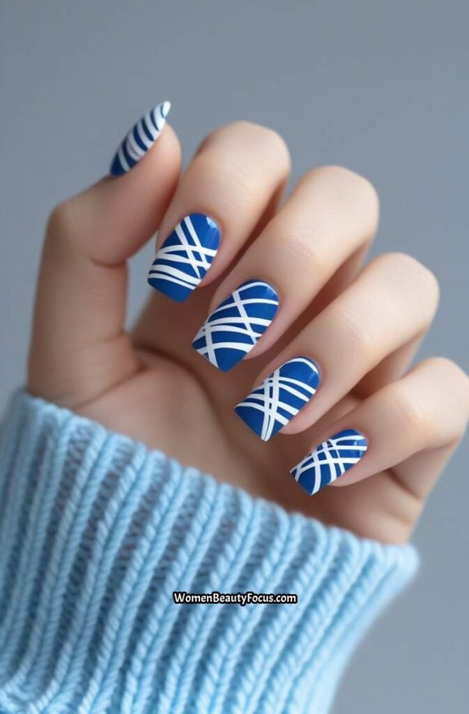 14. Blue and White Abstract Nails