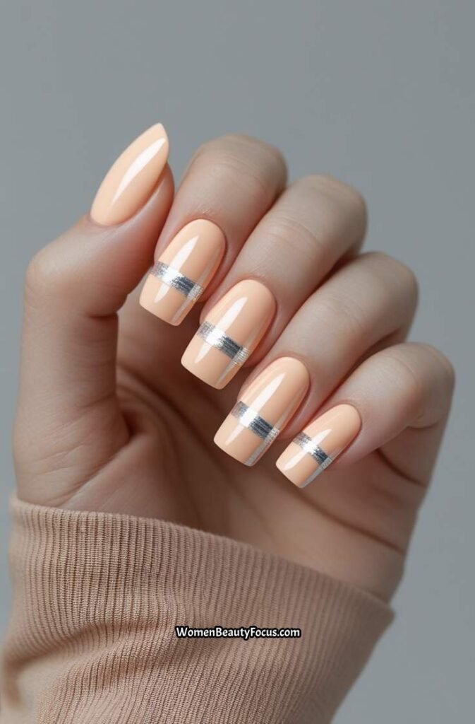 14. Pale Peach Square Nails with Minimal Silver Striping