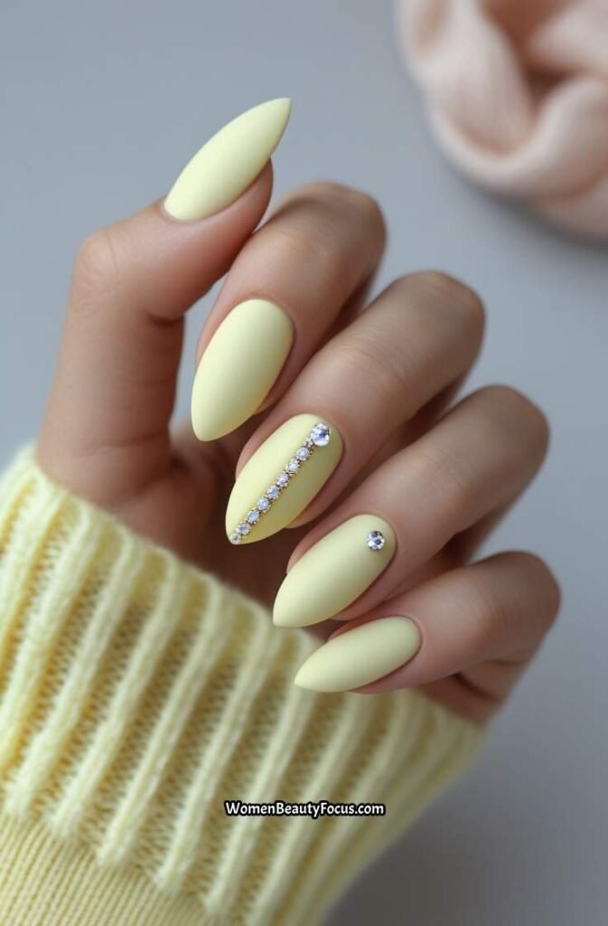 14. Pale Yellow Matte Nails with Tiny Rhinestones