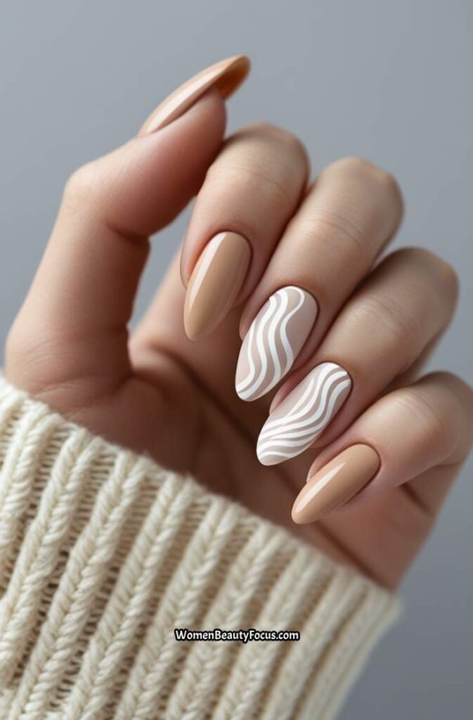 14. Soft Beige Nails with White Abstract Waves