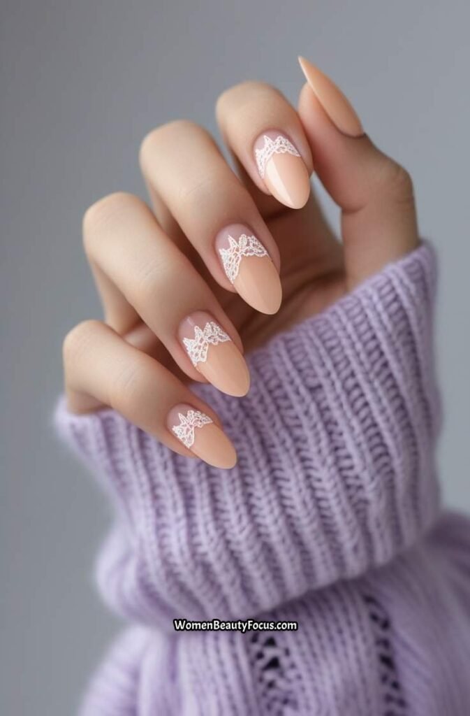 14. Soft Peach Almond Nails with Lace Detailing