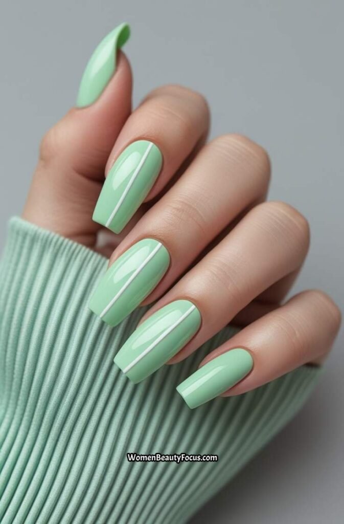 15. Mint Green Coffin Nails with White Accents