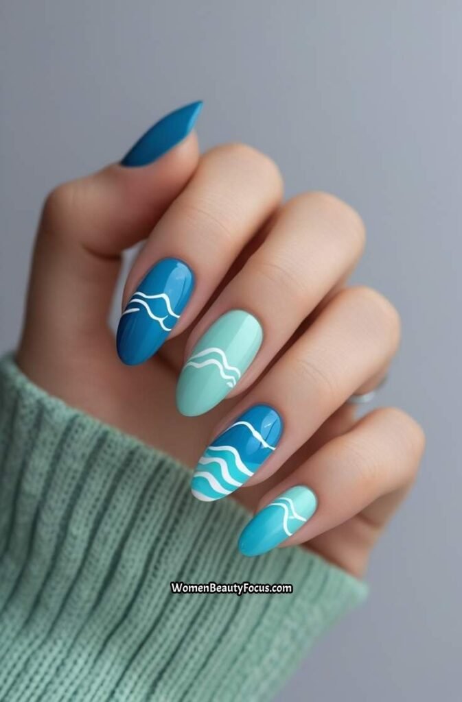 15. Ocean Inspired Blue Nails with Wave Art