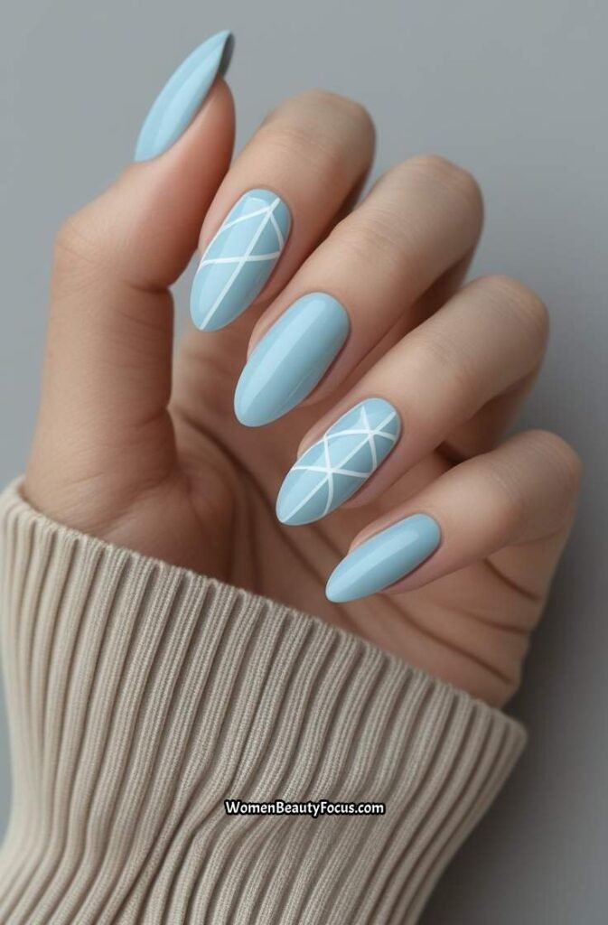 15. Pale Blue Nails with White Geometric Lines