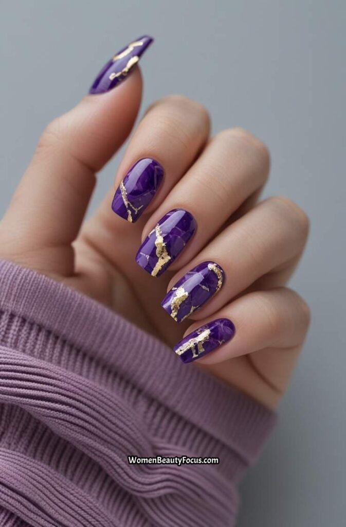 15. Purple Marble and Gold Accent Nails