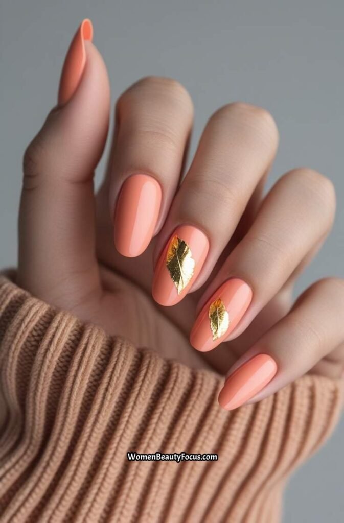 15. Soft Coral Nails with Gold Leaf Detail