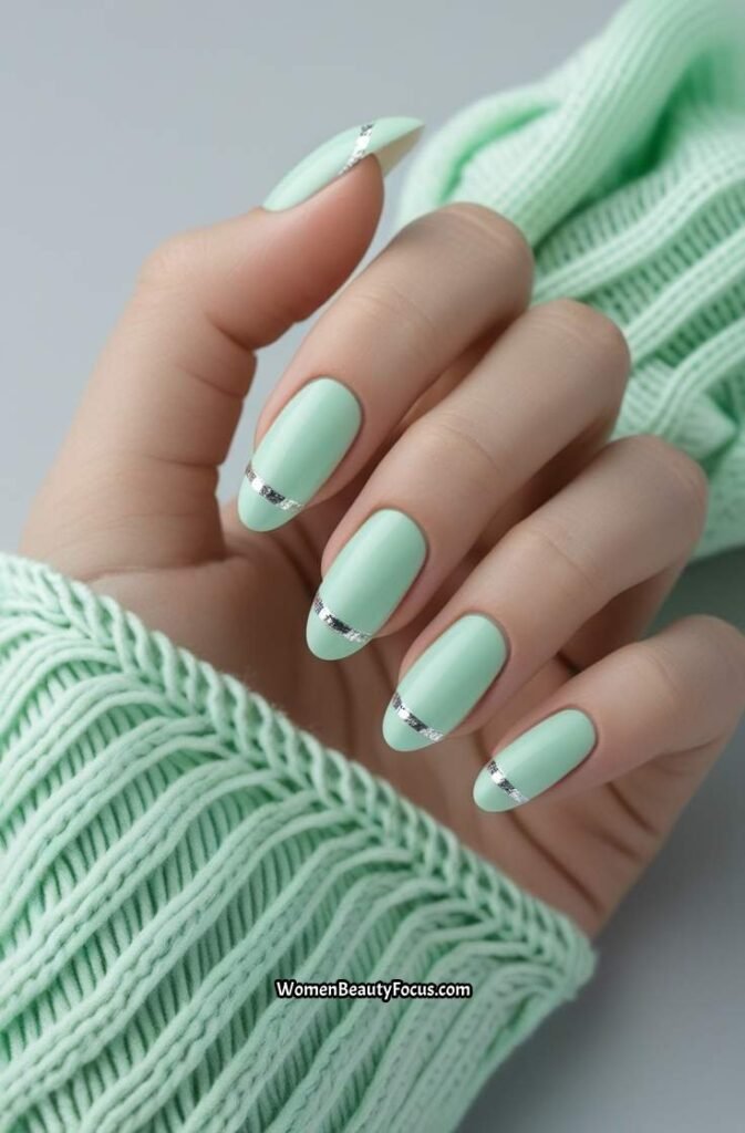 15. Soft Mint French Tips with Silver Detailing