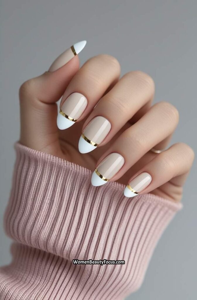 16. Elegant French Tips with Gold Detailing