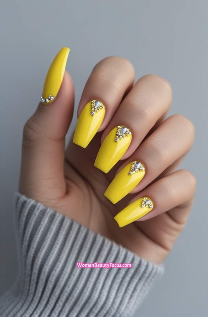 16. Glossy Bright Yellow Nails with Jewels