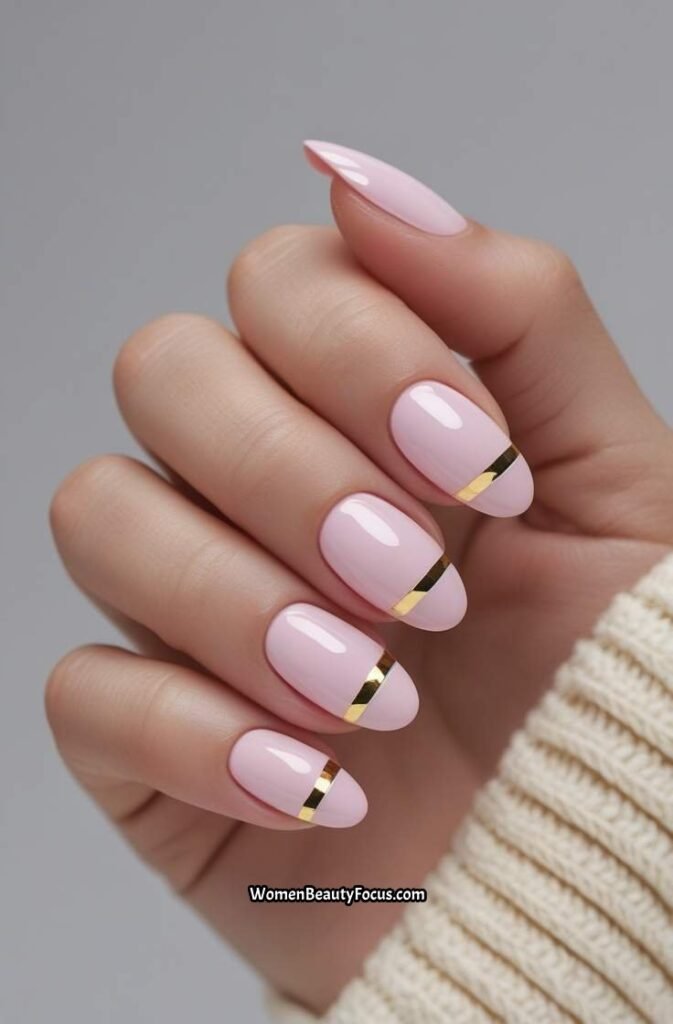 16. Glossy Light Pink Nails with Thin Gold Stripes