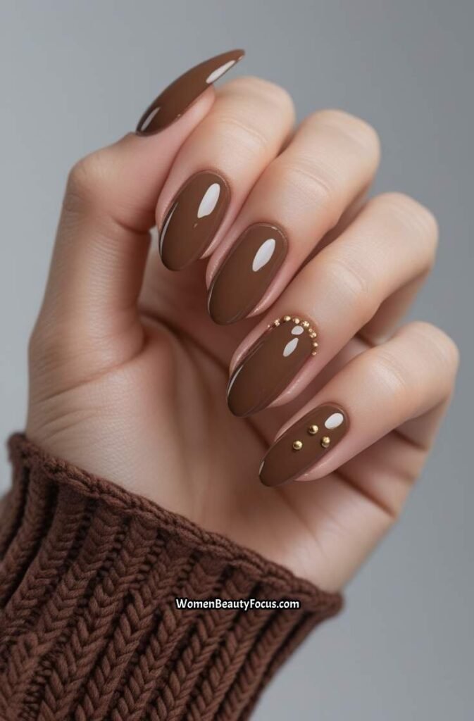 16. Glossy Mocha Nails with Gold Studs