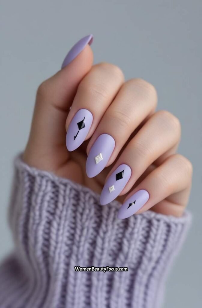 16. Lavender Almond Nails with Black Accents