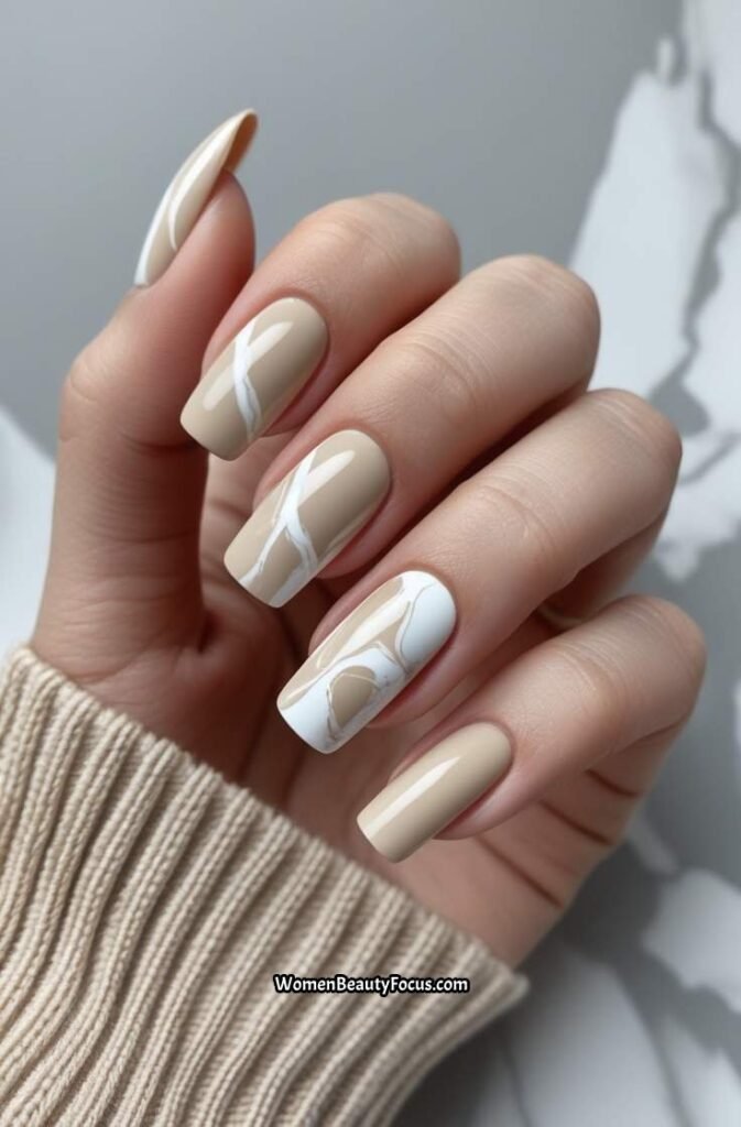 16. Neutral Beige and White Marble Nails