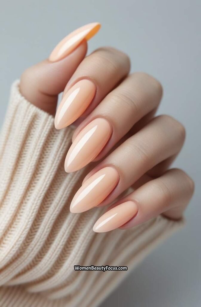 16. Pale Peach Almond Nails with Glossy Shine