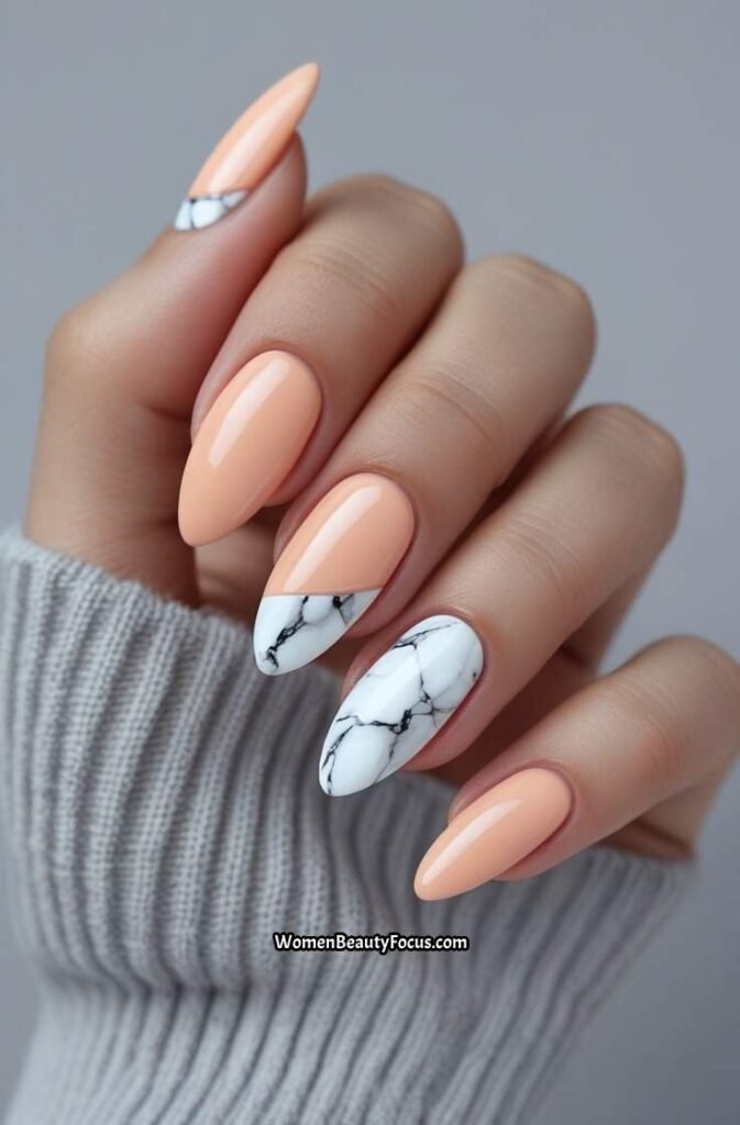 16. Peach Almond Nails with White Marble