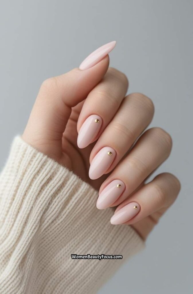 16. Pink Nails with Gold Stud Accents