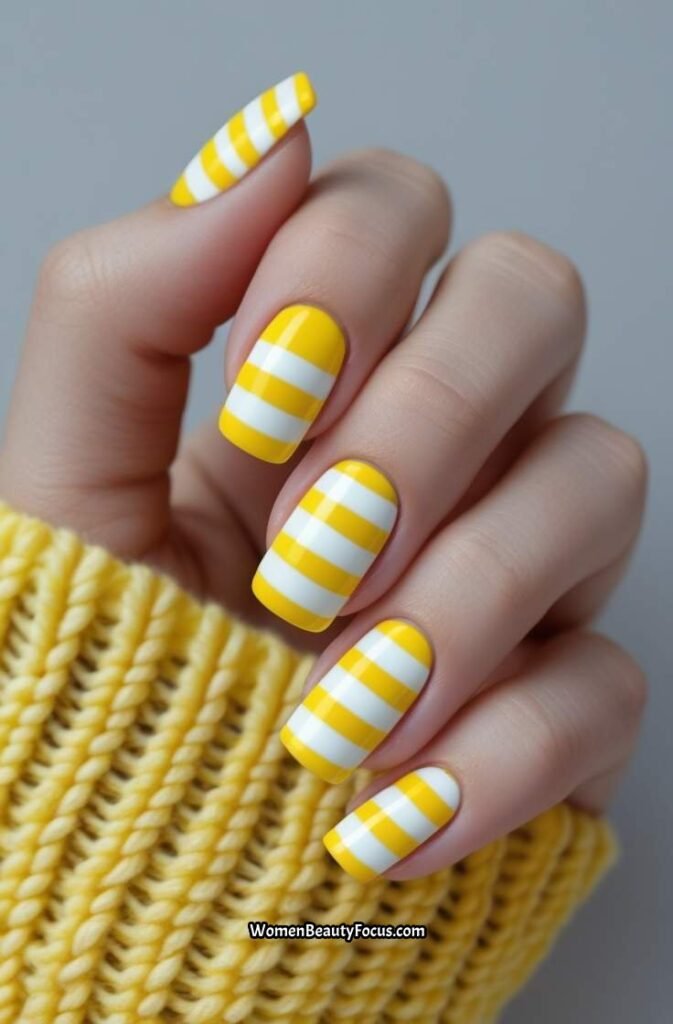 16. Yellow and White Striped Nails