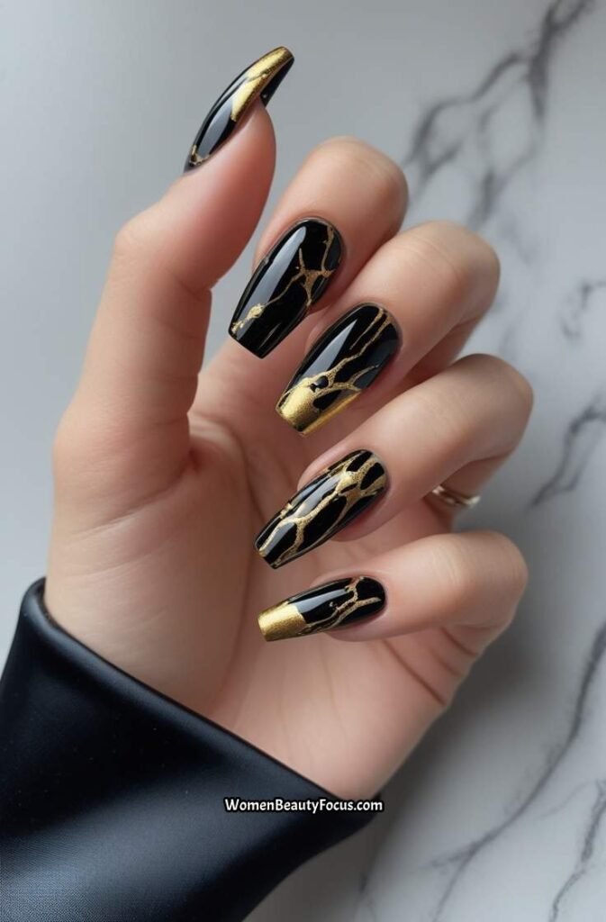17. Black and Gold Marble Nails