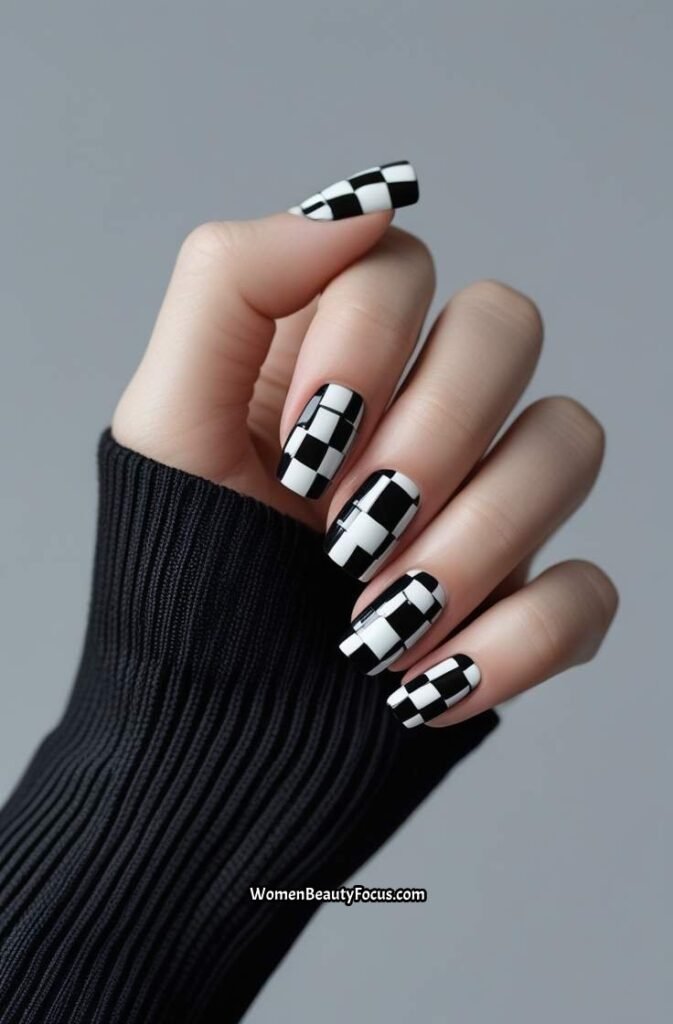 17. Bold Black and White Checkerboard Nails