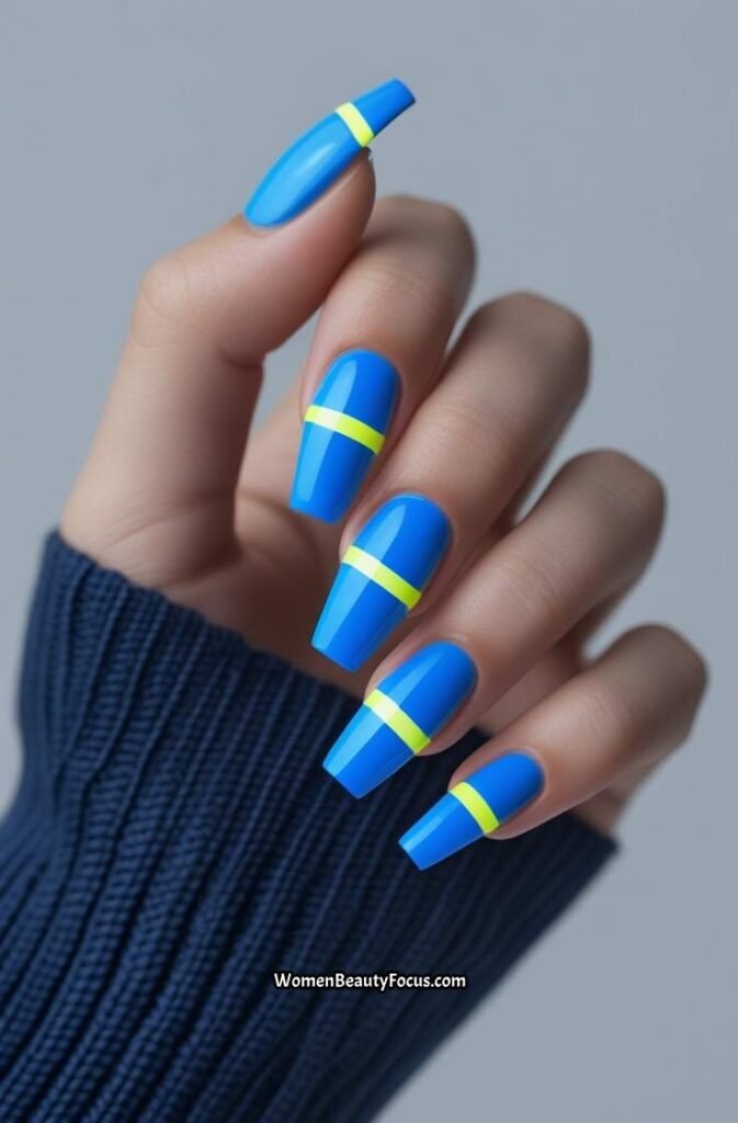 17. Electric Blue Nails with Neon Stripes