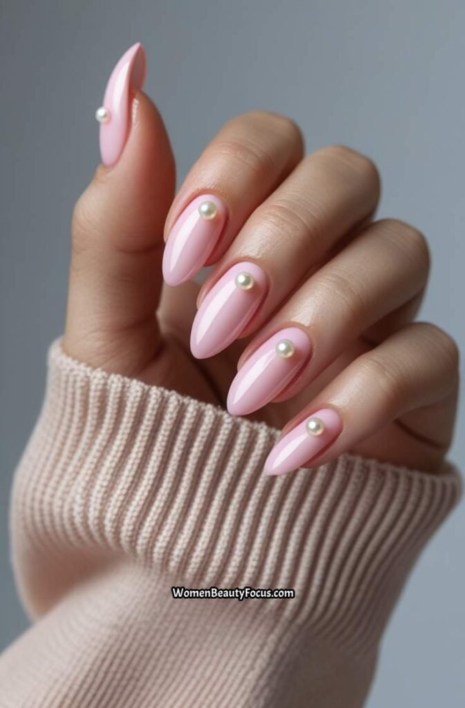 17. Pink Nails with Pearl Embellishments