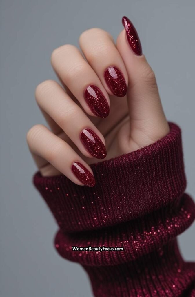 17. Ruby Red Glitter Accent Nails