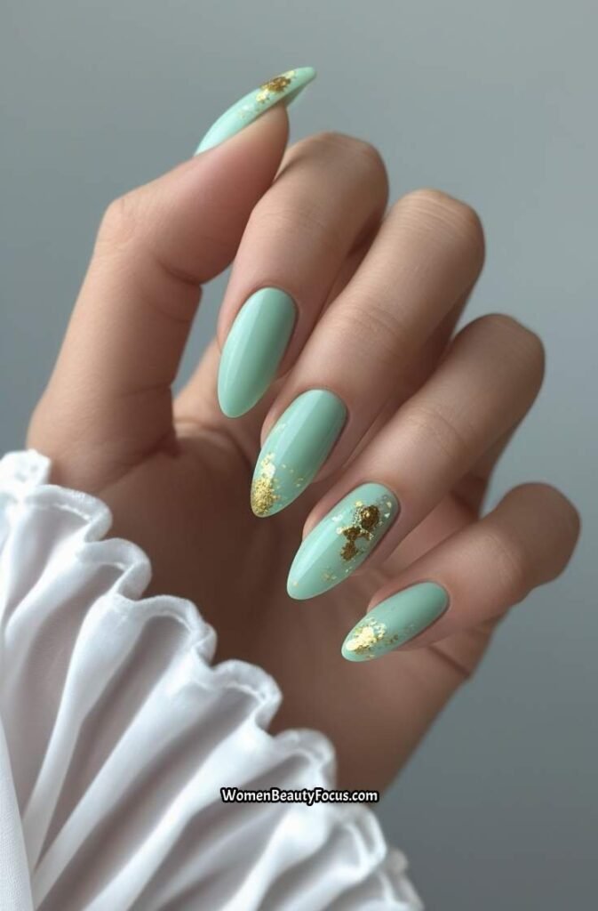 17. Seafoam Green Acrylic Nails with Gold Flakes