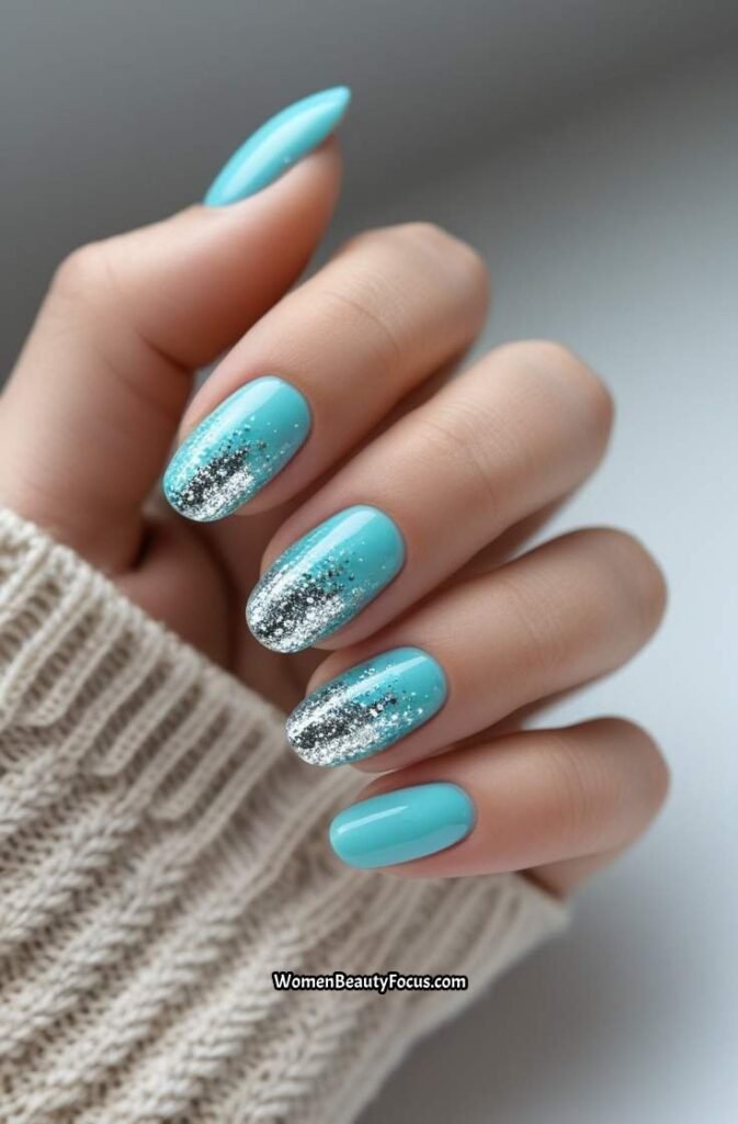 18. Aqua Blue and Silver Glitter Nails